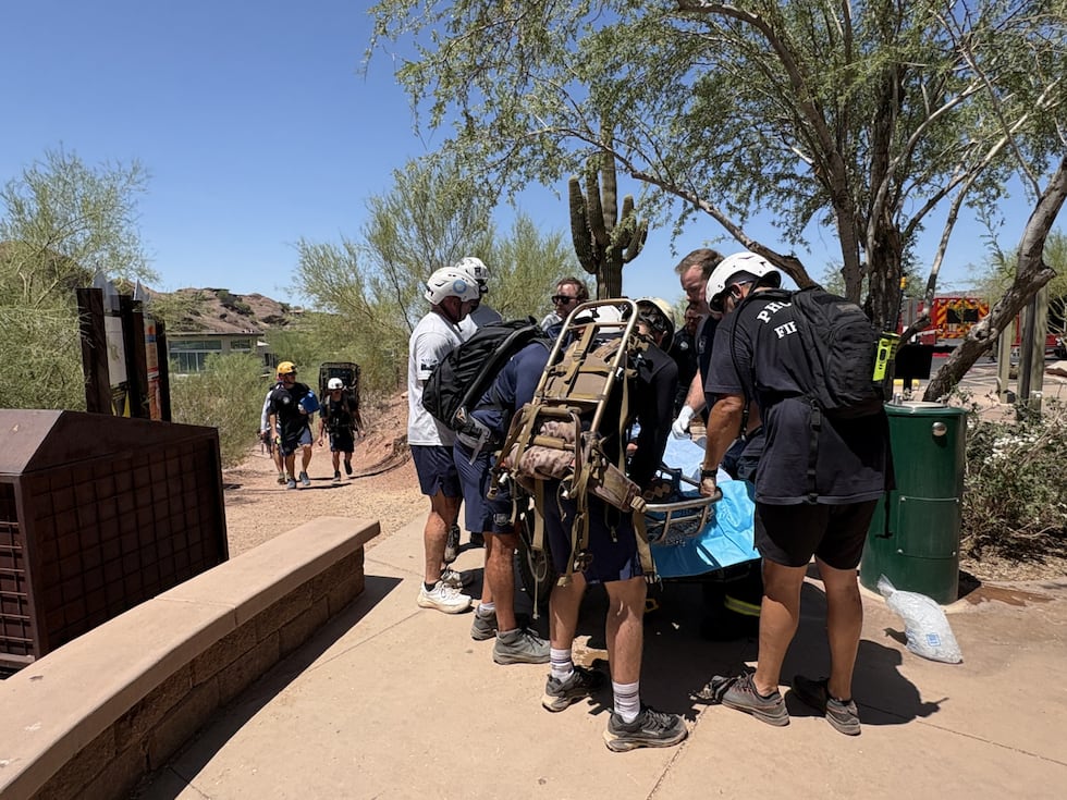 A child is recovering after overheating while hiking with his parents on Camelback Mountain in...