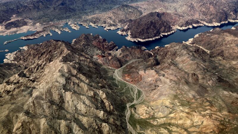 FILE - In this aerial photo, a bathtub ring of light minerals show the high water mark on the...