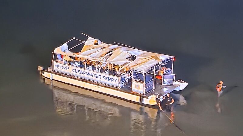 This image provided by Mike Boylan shows authorities at the scene of a boat crash that...