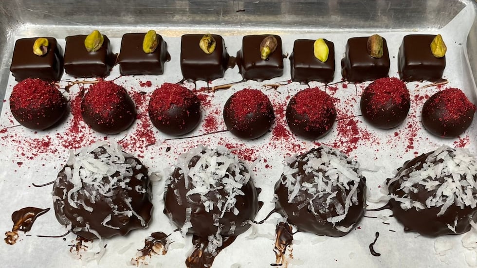 Chocofin Chocolatier serves delicious homemade chocolates, such as a pistachio crunch based on...