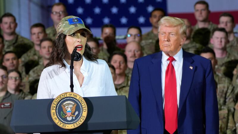 President Donald Trump listens as Michigan Gov. Gretchen Whitmer speaks to members of the...