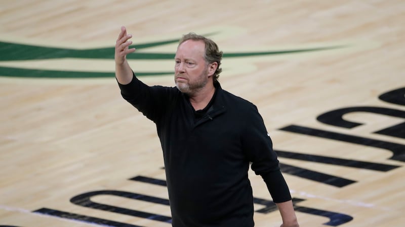 FILE - Milwaukee Bucks coach Mike Budenholzer directs the team during the first half against...
