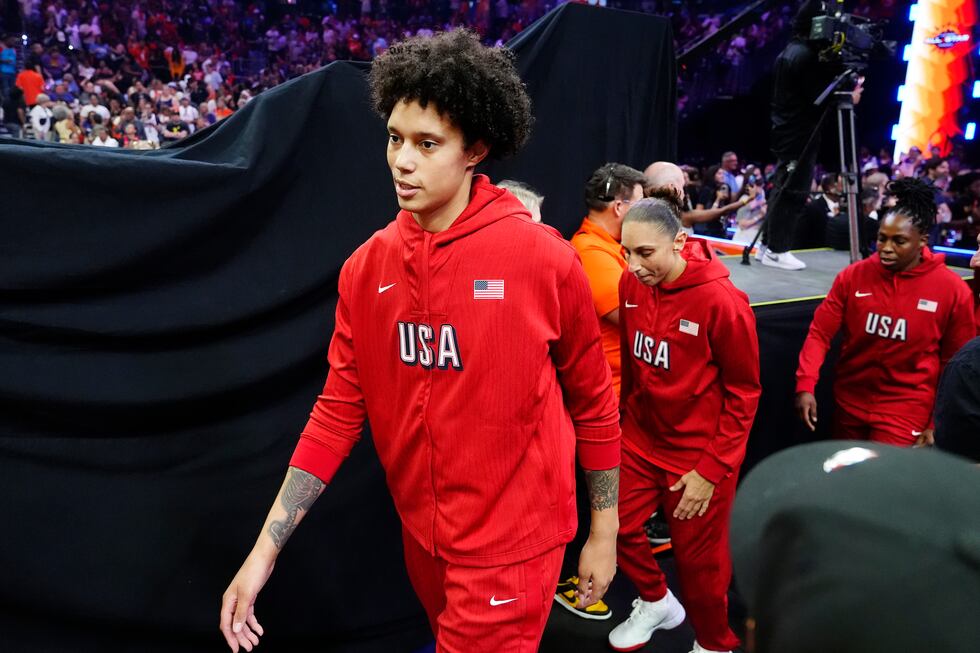 Brittney Griner, left, Diana Taurasi, and Chelsea Gray, of Team USA, walk on the court prior...