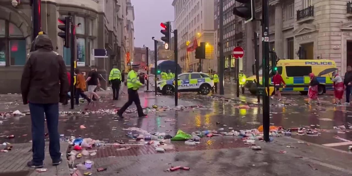 Dozens hurt when car plows into Liverpool soccer fans at parade